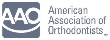 Logo of the American Association of Orthodontists with grey text and a stylized smile on a dark background.